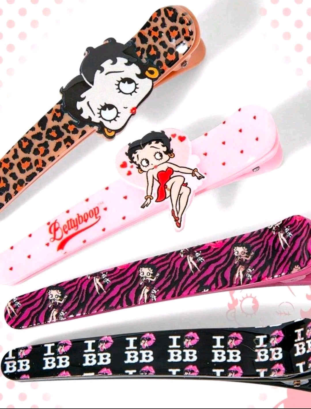 Assorted character hair clips featuring leopard, pink hearts, zebra, and striped prints