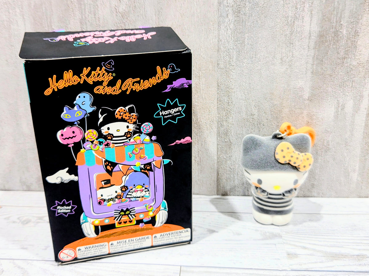 Hello Kitty hanger box with flocked grey cat bag clip beside it