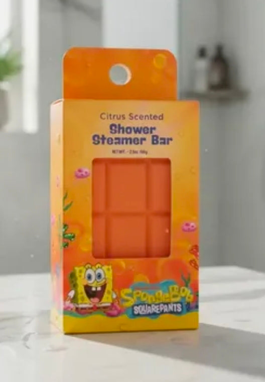 Citrus scented shower steamer bar package on a light countertop