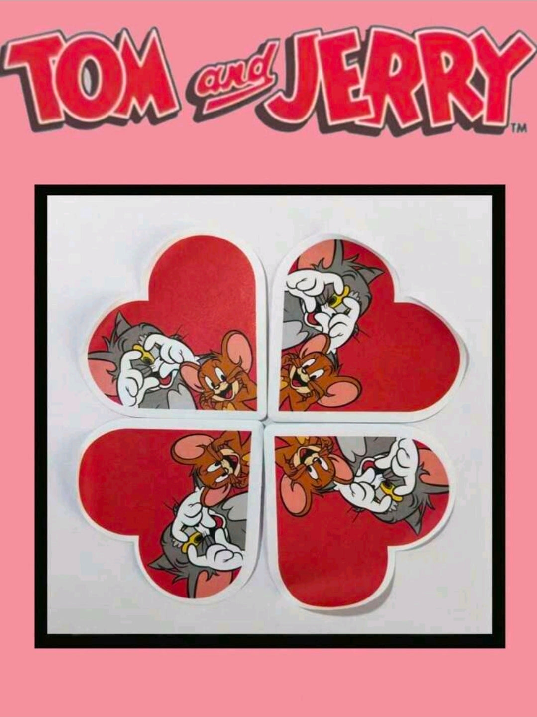 Red heart-shaped sticky notes with Tom and Jerry character prints, arranged in four