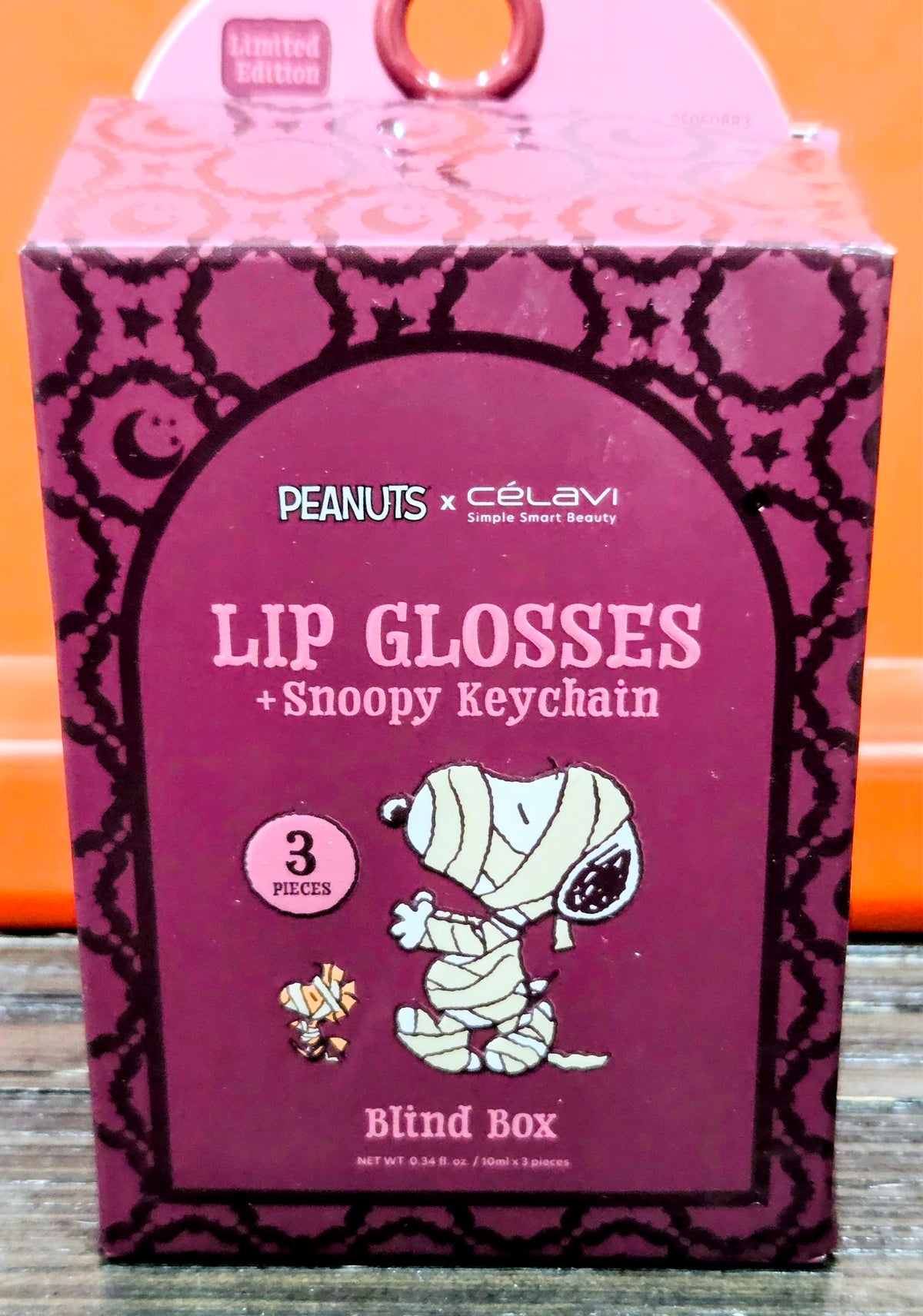 Lip glosses + Snoopy keychain blind box package with Snoopy illustration