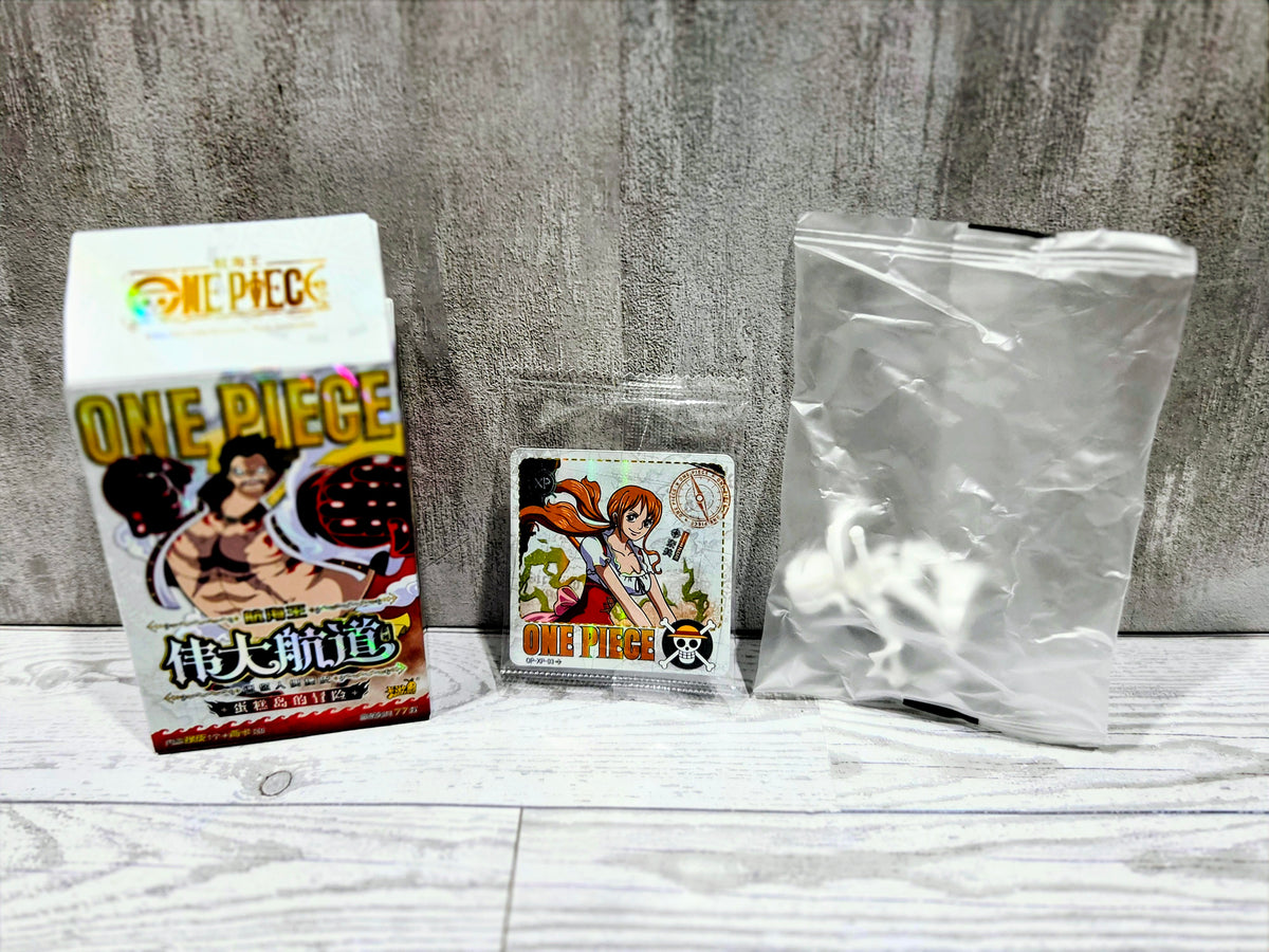 One Piece figure set: boxed character, small card, and empty clear pouch
