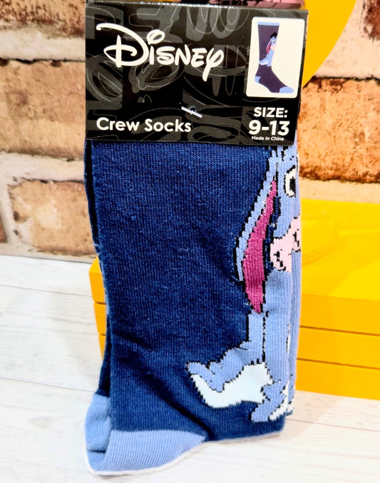 Packaged blue crew socks featuring Eeyore graphic, size tag near top