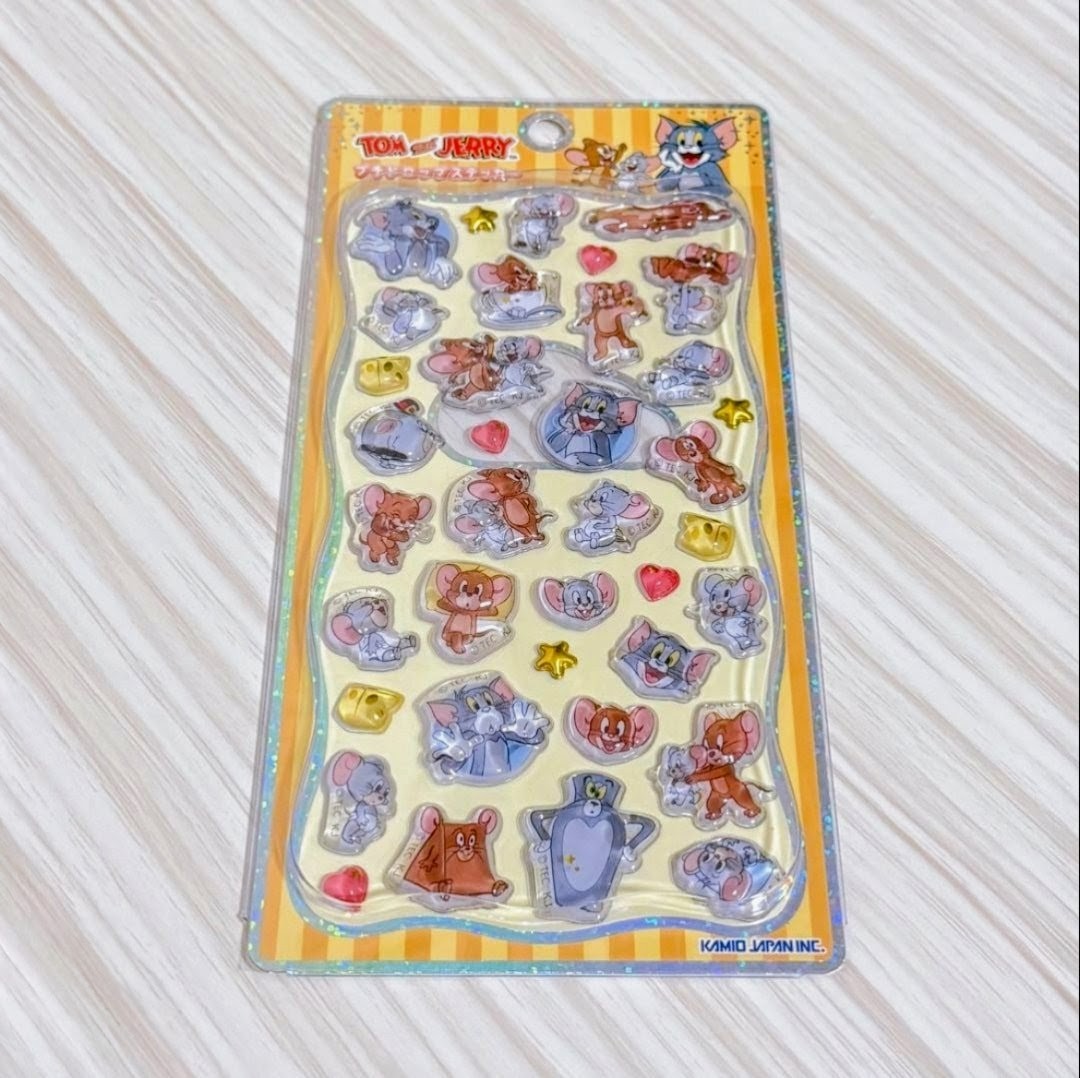3D acrylic sticker sheet with Tom and Jerry character icons, hearts, and stars