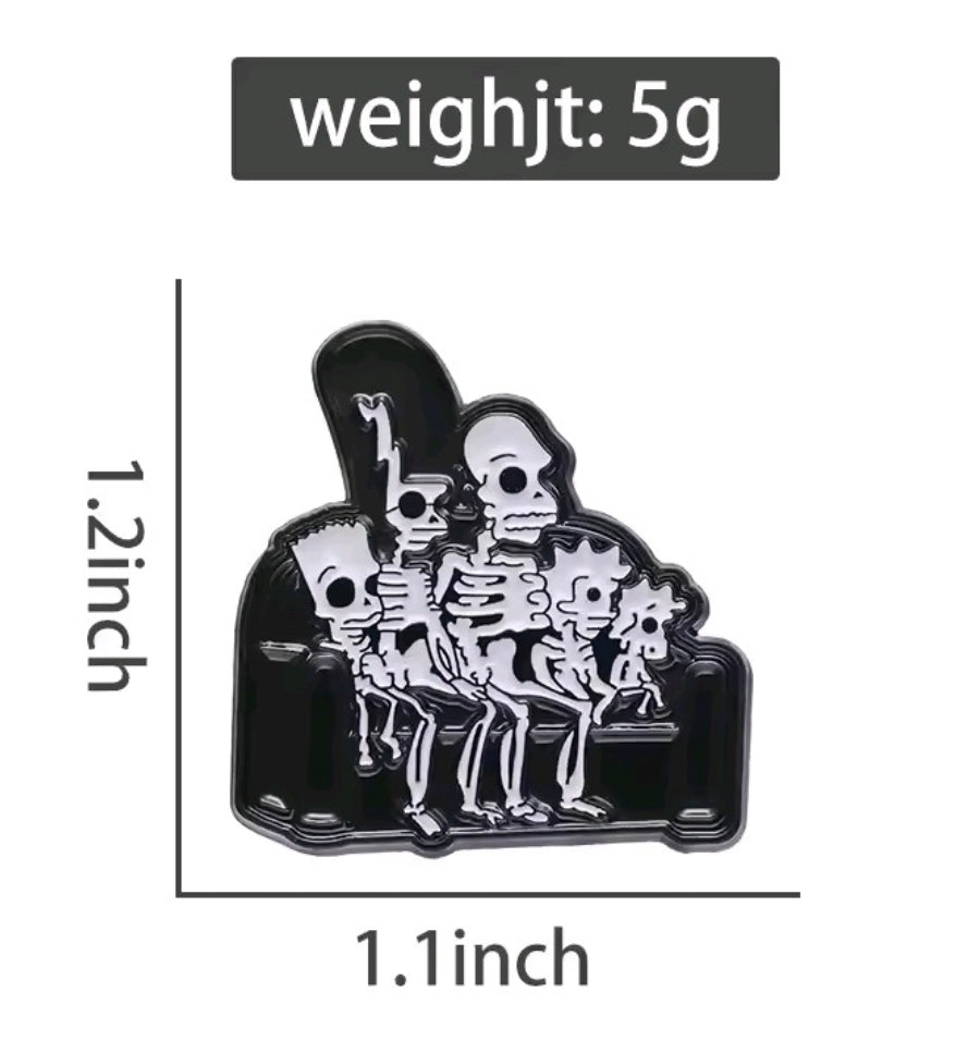 Enamel pin showing a skeleton group under a dark arch frame