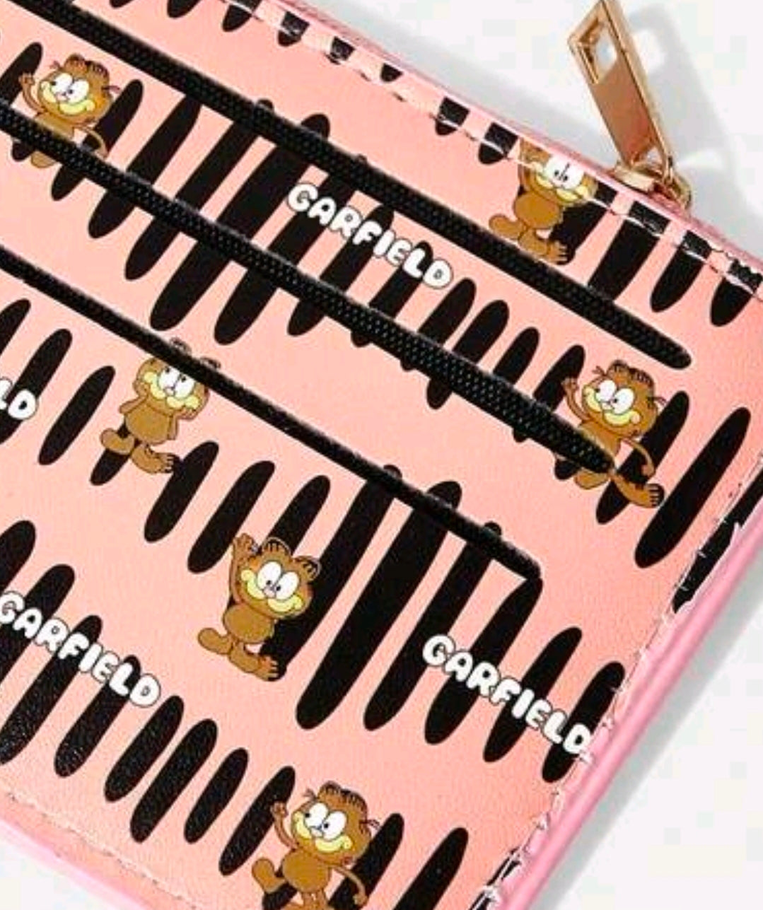 Pink zip coin purse card holder with black stripe Garfield pattern, gold zipper pull.