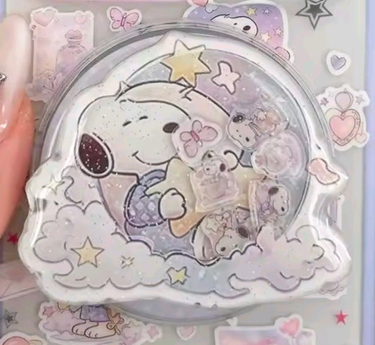 Close-up Snoopy acrylic glitter shaker grip with stars and clouds inside clear bubble