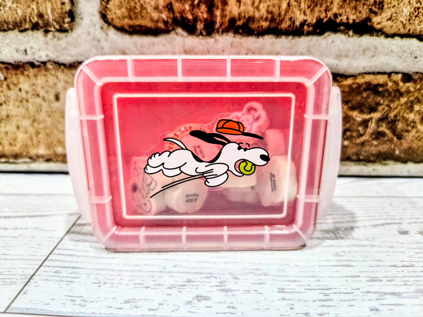 Clear desktop organizer box with pink base, Snoopy graphic panel