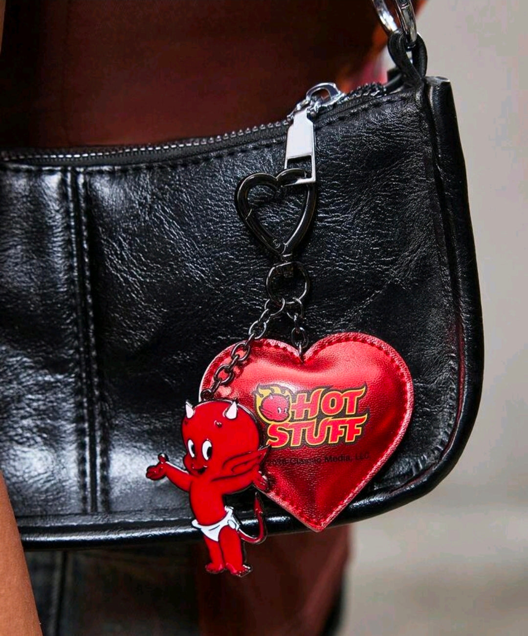 Red faux leather heart keychain with 'Hot Stuff' logo and little devil charm