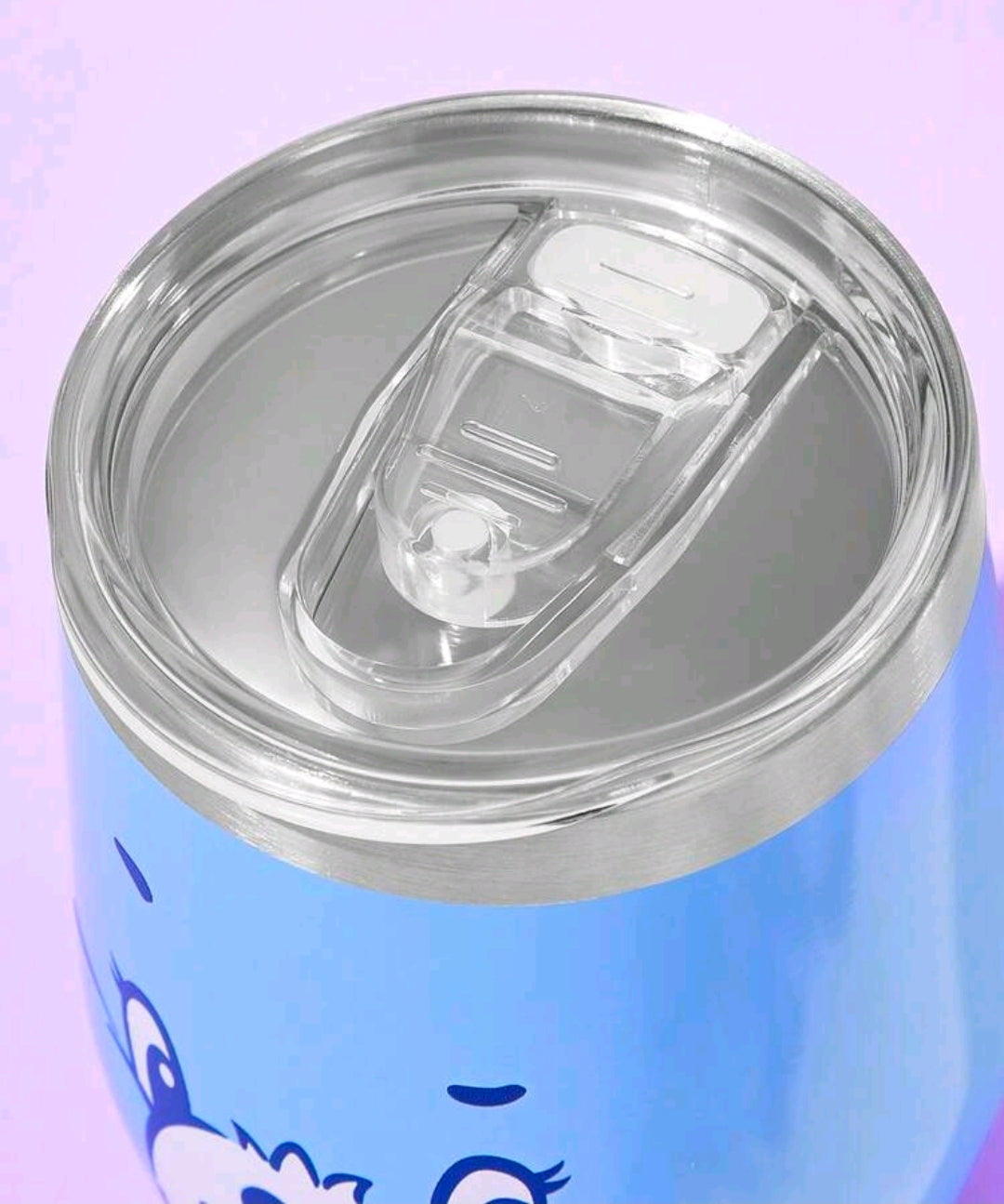 Blue insulated tumbler with clear lid and stainless steel top rim