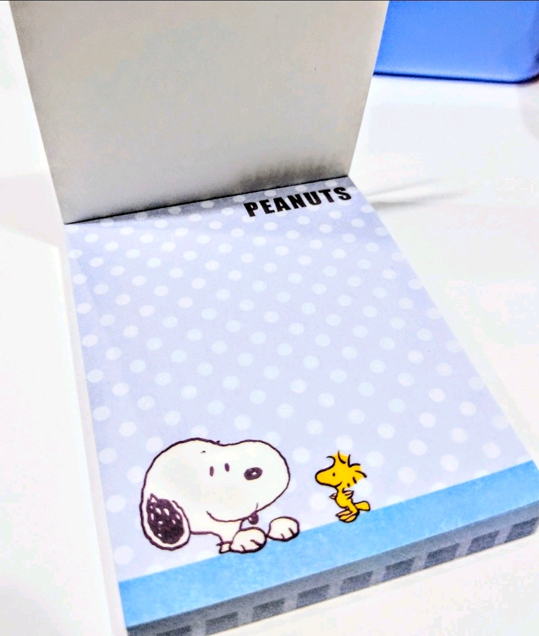 Peanuts Snoopy memo pad with light blue dots and character illustration on cover