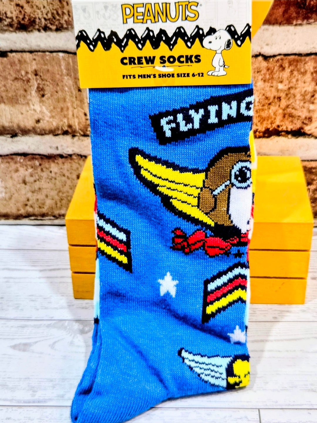 Blue Snoopy flying ace crew socks with airplane graphic and “FLYING” lettering