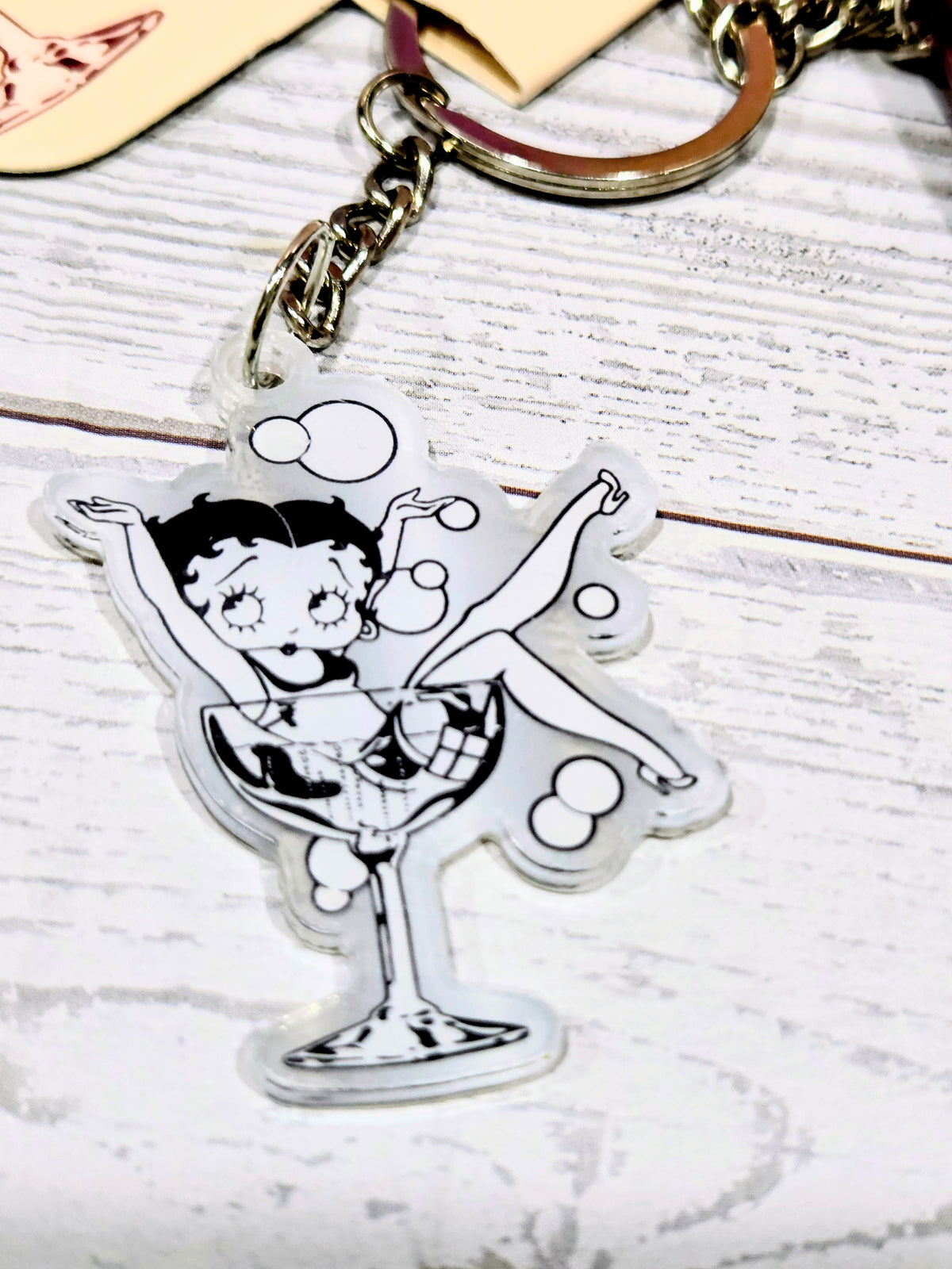 Acrylic Martini glass charm keychain with Betty Boop figure on metal ring