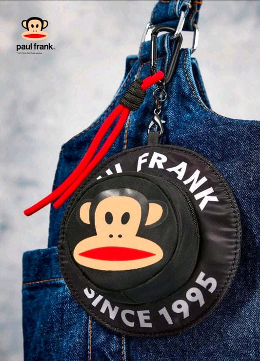 Round black monkey-face coin pouch with zipper, red cord tassel, and hanging clip