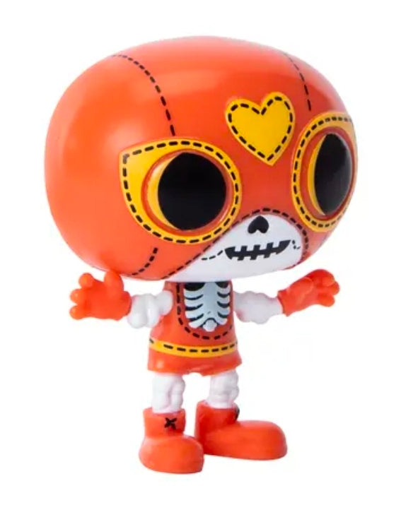 Orange skull Halloween vinyl mini figure with large black eyes and heart heart detail
