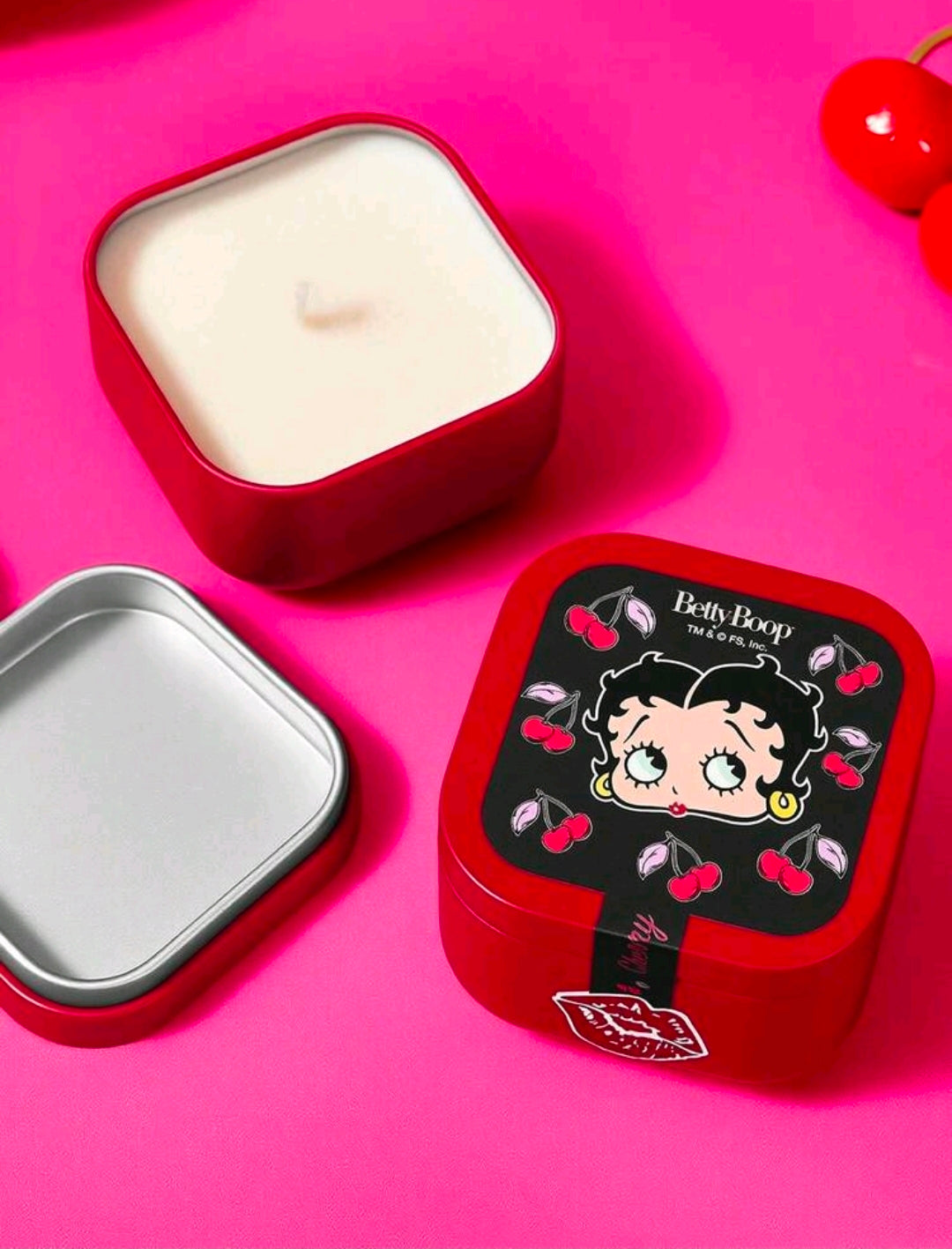 Red square candle tin with open lid and Betty Boop cherry graphics