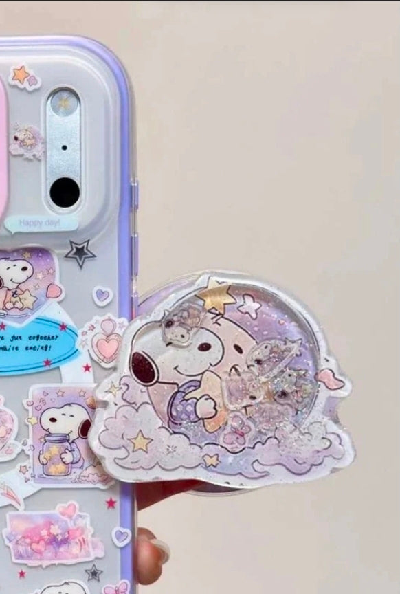 Shaker phone grip with Snoopy and stars on a clear lavender phone case, round glitter front