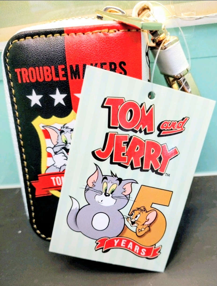 Smart key case in red and black with “Trouble Makers” graphic and hanging tag