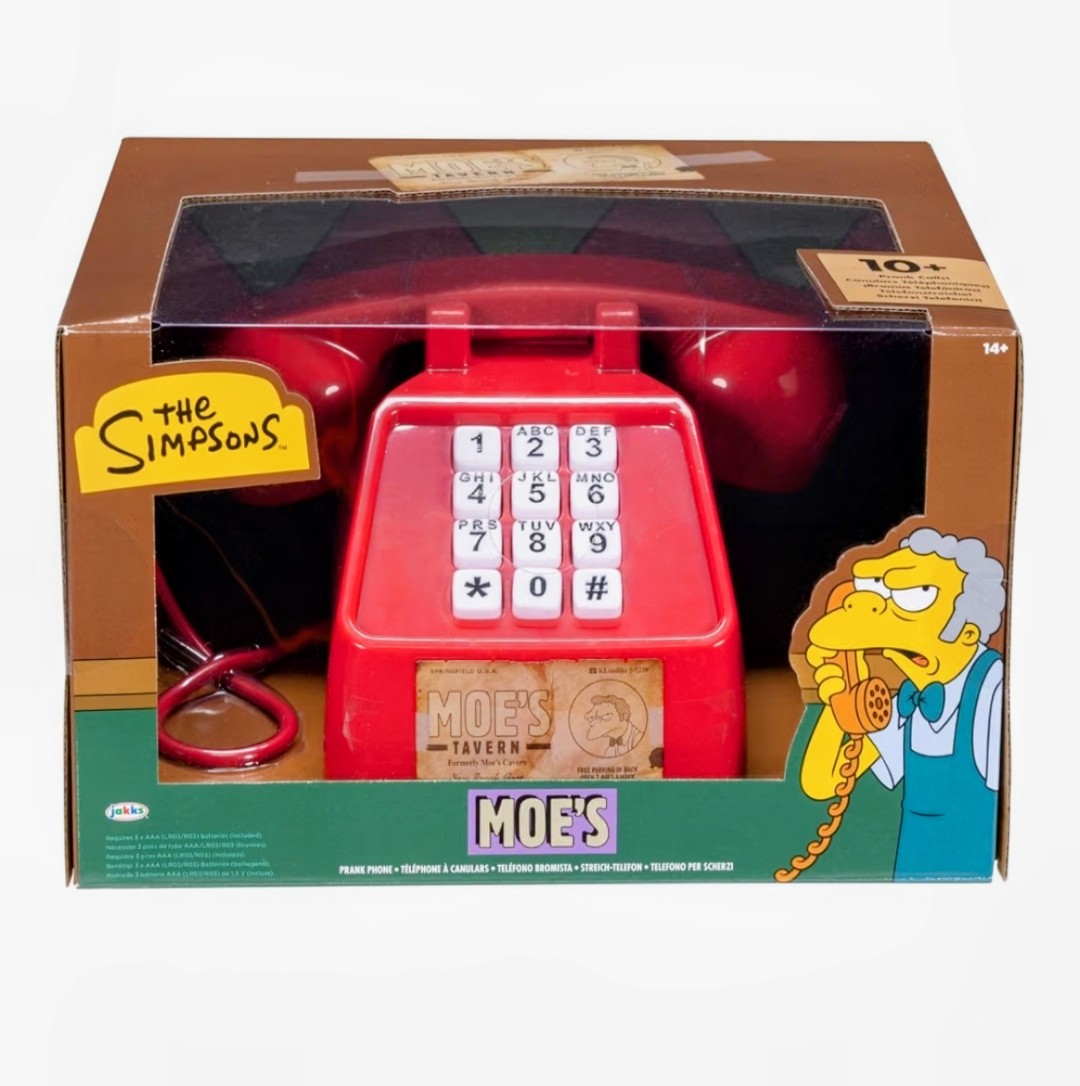 Open retail packaging showing red Moe’s Tavern prank phone with handset and keypad