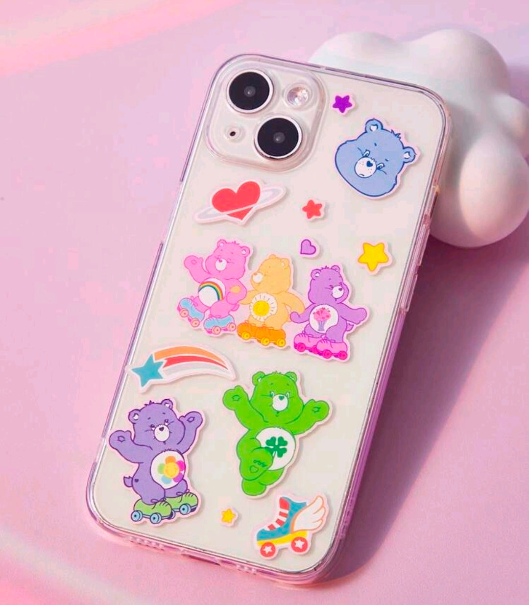 Phone case with Care Bears sticker designs, rainbows, hearts, and star accents