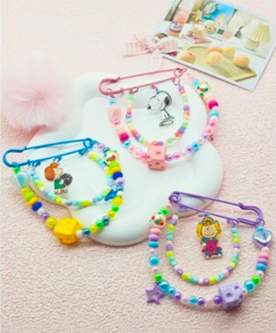 Assorted Peanuts beaded safety pin keychains set with colorful beads and metal safety pins