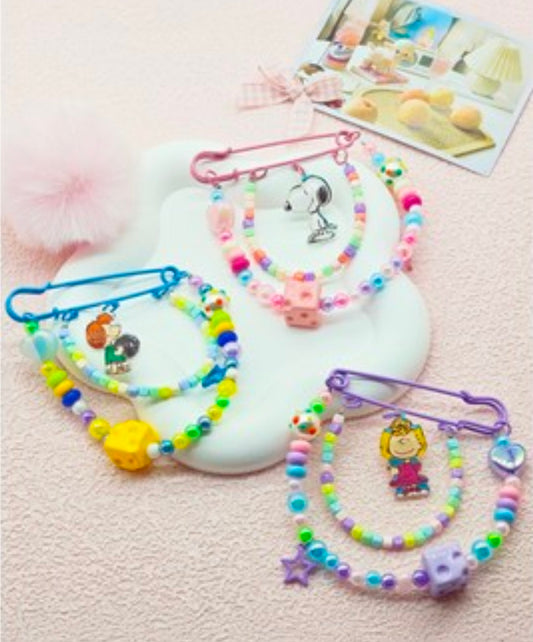 Assorted Peanuts beaded safety pin keychains set with colorful beads and metal safety pins