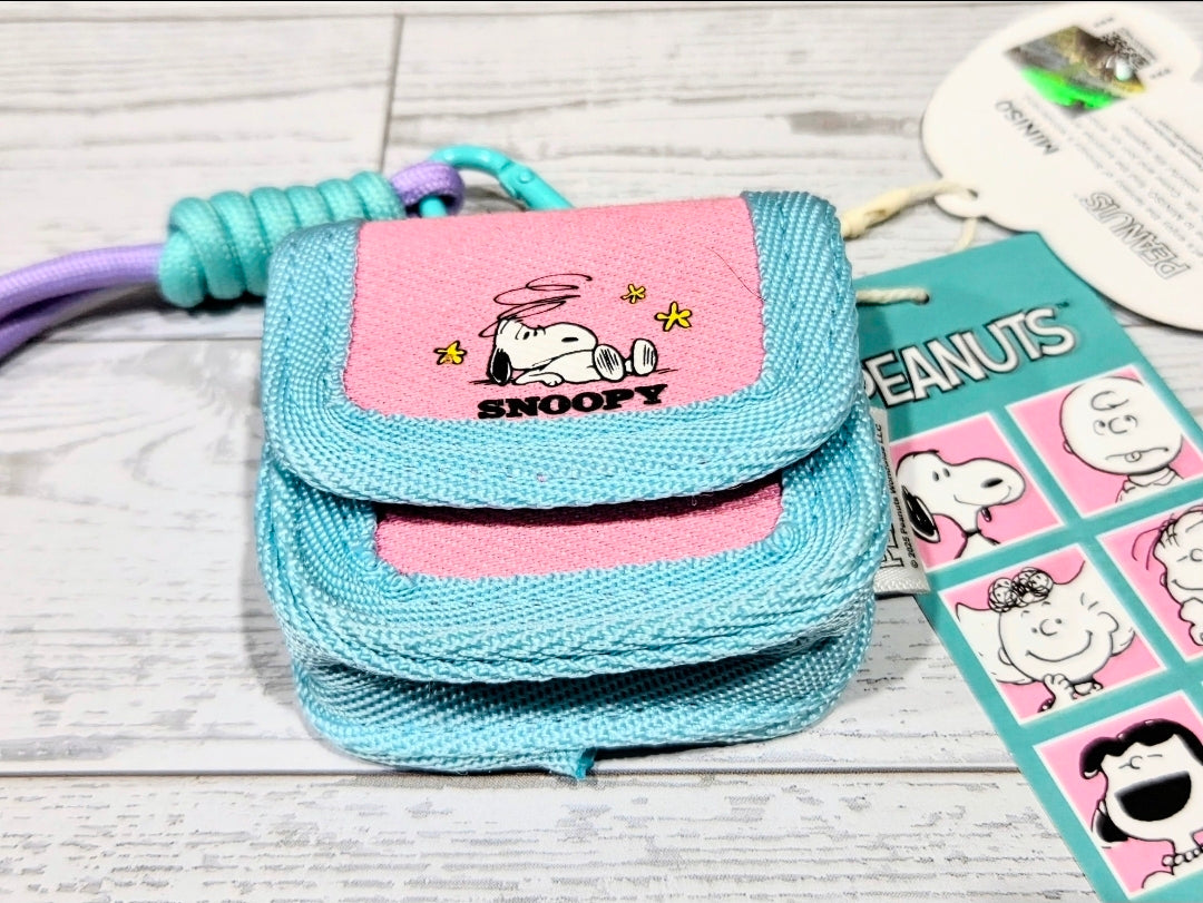 Colorful canvas earbud case with wrist strap, teal and pink, Snoopy patch flap