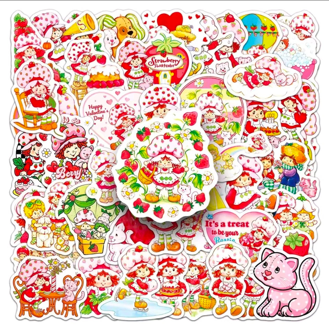 Vinyl die-cut sticker pack spread out with strawberry characters, hearts, and cat motifs