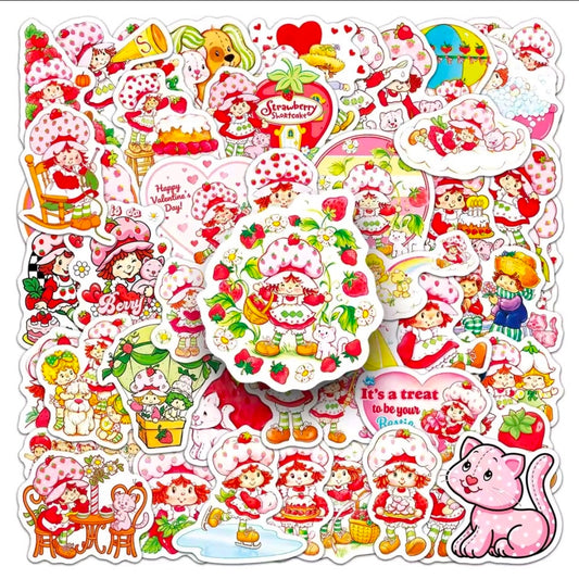 Vinyl die-cut sticker pack spread out with strawberry characters, hearts, and cat motifs