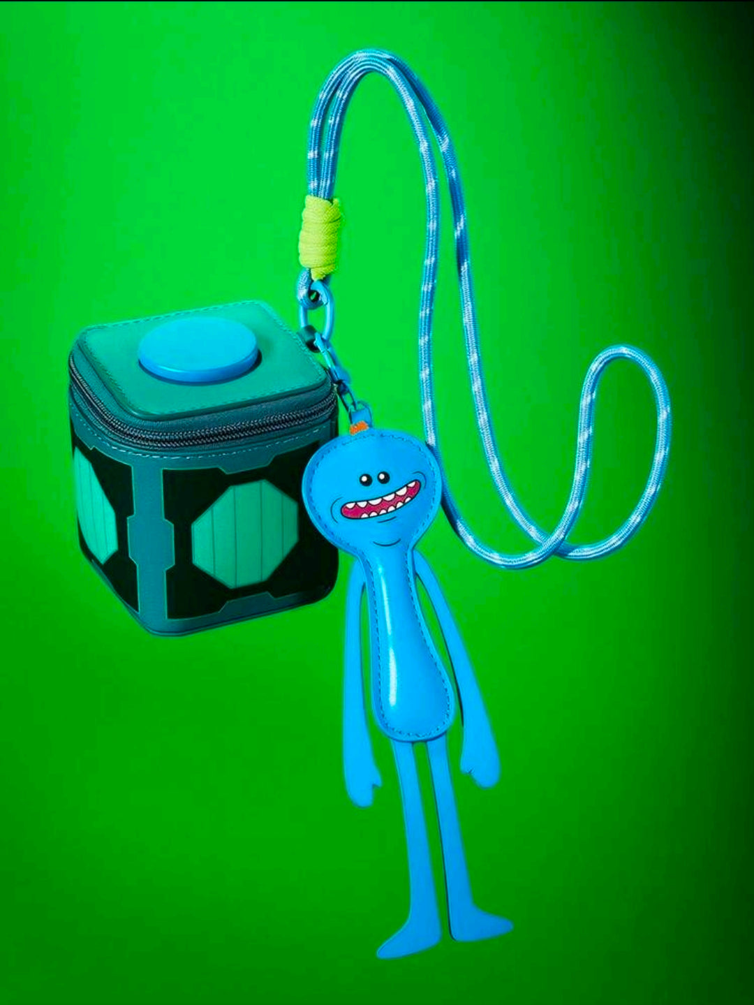 Teal change bag with snap top and hanging Meeseeks charm on lanyard