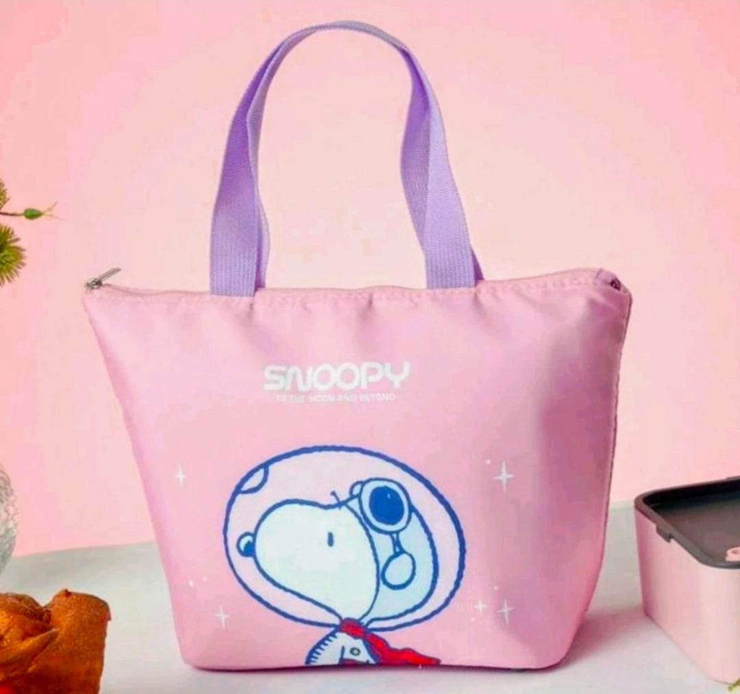 Pink insulated lunch bag with purple handles and blue Snoopy graphic on front