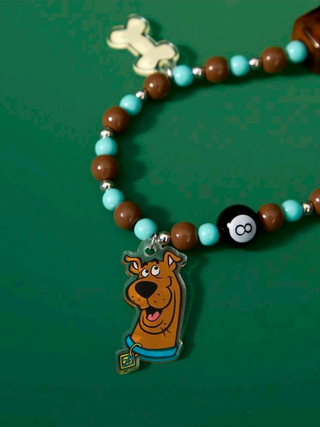 Scooby-Doo beaded phone lanyard with Scooby face charm and dog-bone charm on beaded strand