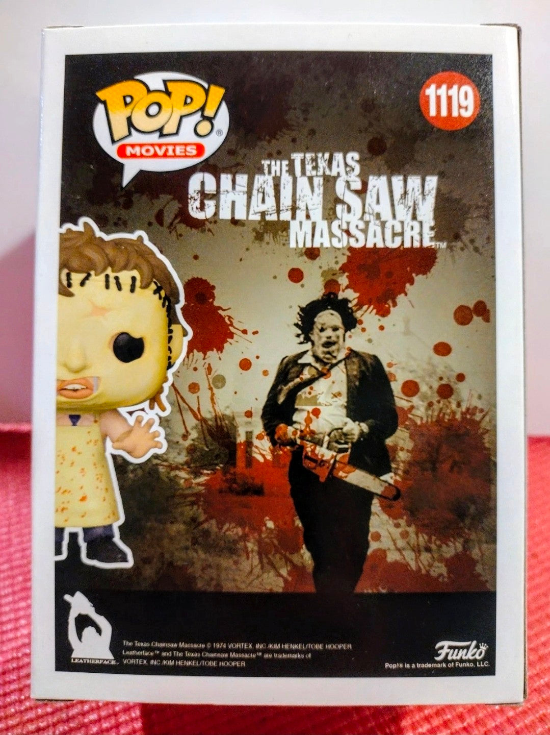 Vinyl figure in retail box showing Leatherface character and Texas Chainsaw artwork
