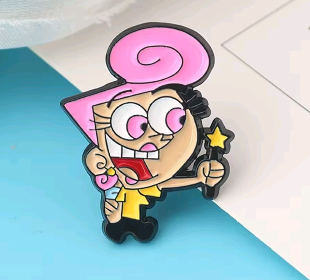 Wanda enamel pin with pink hood, smiling face, and star charm.