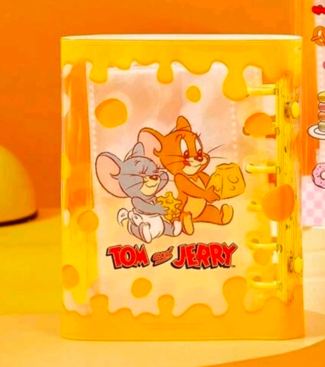 Yellow puzzle-style A7 sticker binder planner cover with Tom & Jerry holding cheese