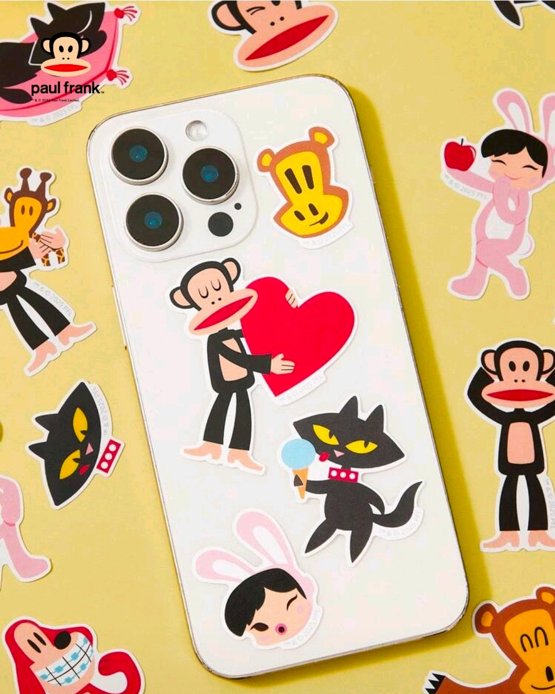Vinyl character stickers applied to a phone case: monkey, cat, and heart design
