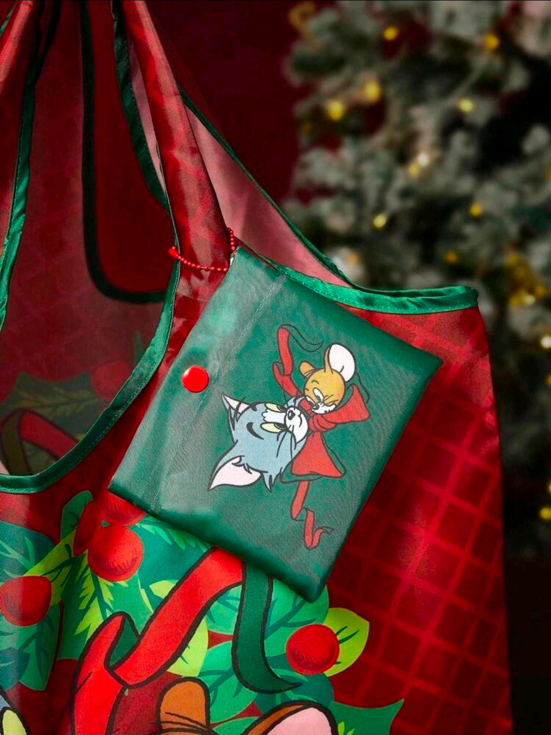 Green snap pouch with Tom and Jerry character print, attached inside tote.