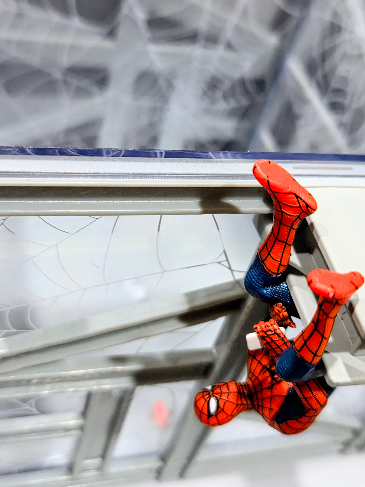 Collectible popcorn bucket interior with Spider-Man figure perched on side