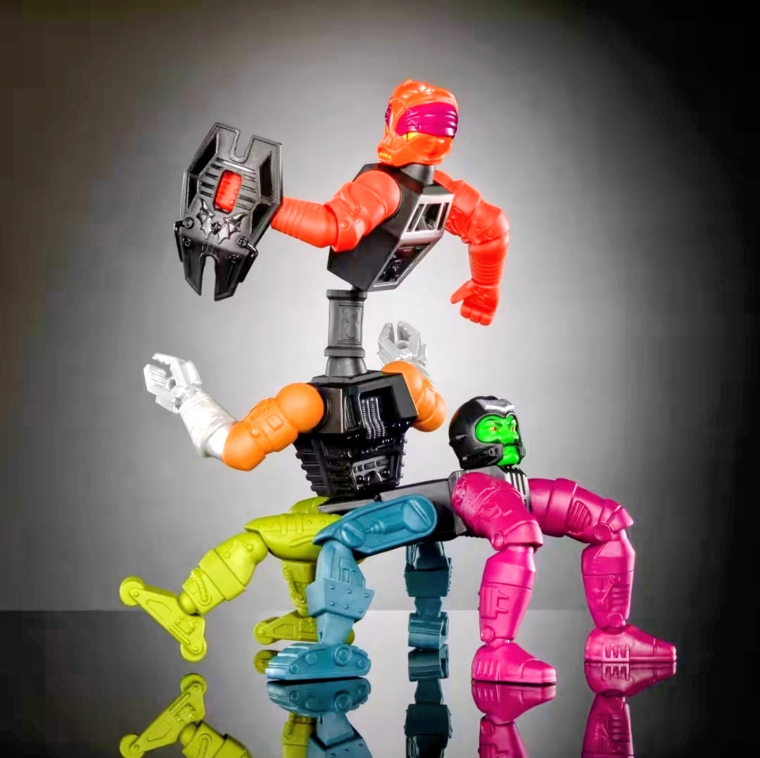 Modular action figure group with orange and green heads holding accessory weapons