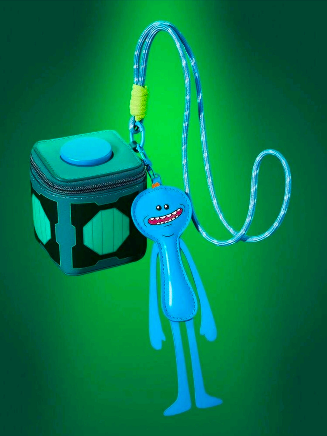 Teal change bag with snap top and hanging Meeseeks lanyard charm