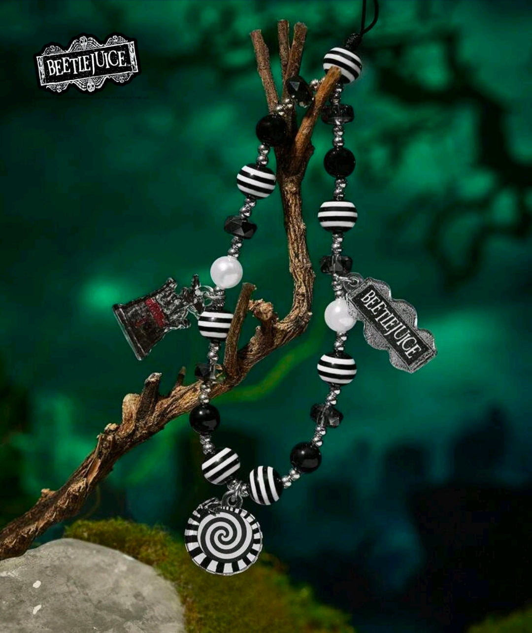 Beetlejuice beaded phone lanyard with striped beads, hat charms, and spiral pendant