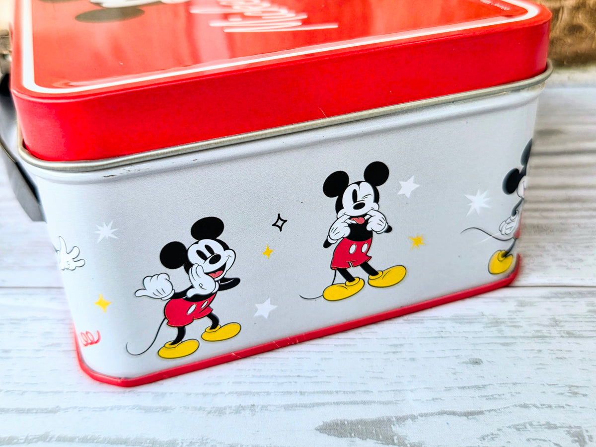Rectangular metal snack tin with Mickey and Minnie cartoon graphics
