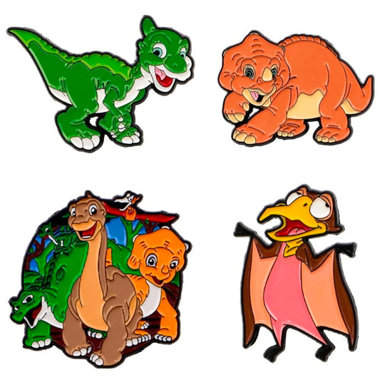 Four enamel pins: green dinosaur, orange tiger-like animal, brown dinosaur trio, duck