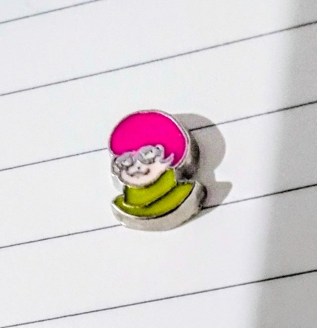 Character floating charm: light-haired figure with pink hood and green cape on round base