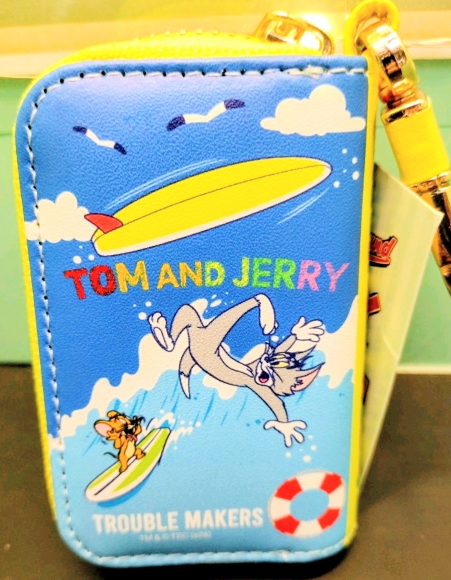 Blue smart key case with cloud and surfboard graphic; yellow zipper hardware