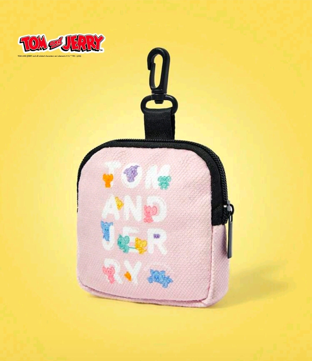 Pink mini zip coin pouch with multicolor animal print, black top loop and zipper