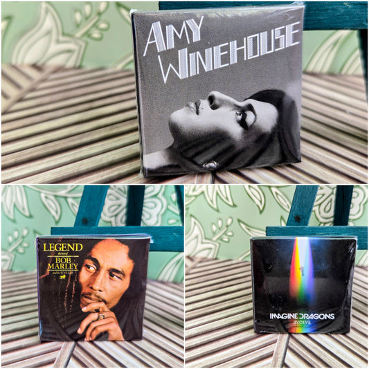 Three vinyl record sleeves: Bob Marley, Imagine Dragons, Aimy Winehouse