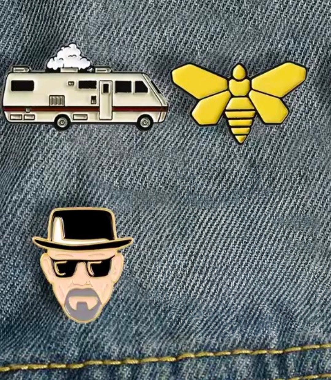 Three enamel pins set: RV camper, yellow bee, and Heisenberg face on denim