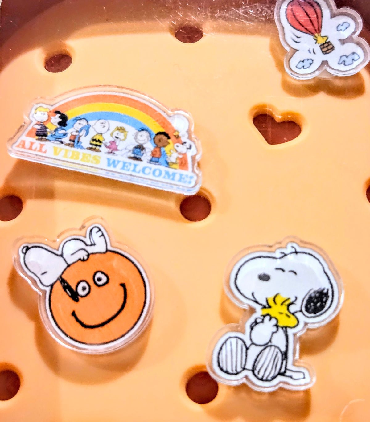 Orange brush charm display tray with acrylic Snoopy and character charm pieces