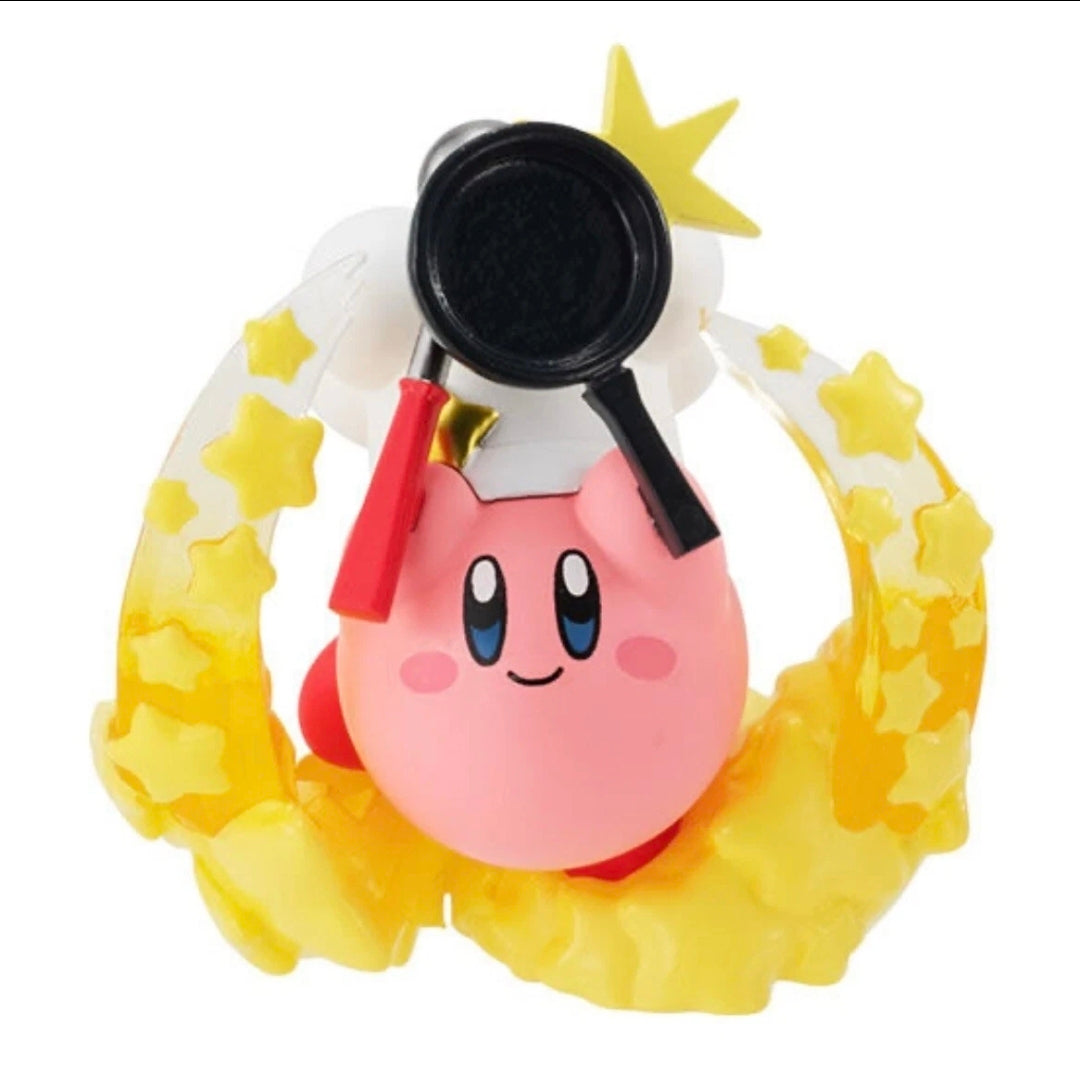 Kirby gashapon figure with black circular lens, yellow star accents, and white body